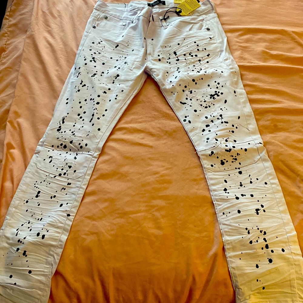 Stacked white jeans